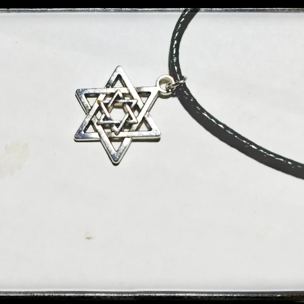 Silver Tone Star with Black Cord Necklace